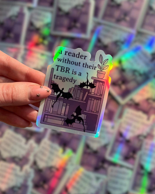 A reader without a TBR is a tragedy holographic sticker - fantasy romance reader sticker